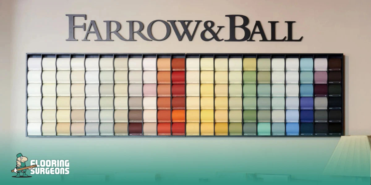 Farrow & Ball paint colour chart display showing a wide range of rich, layered shades in a showroom setting