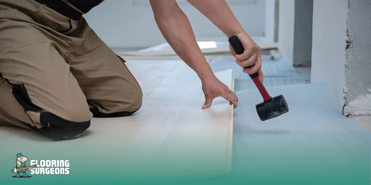 A person installing flooring