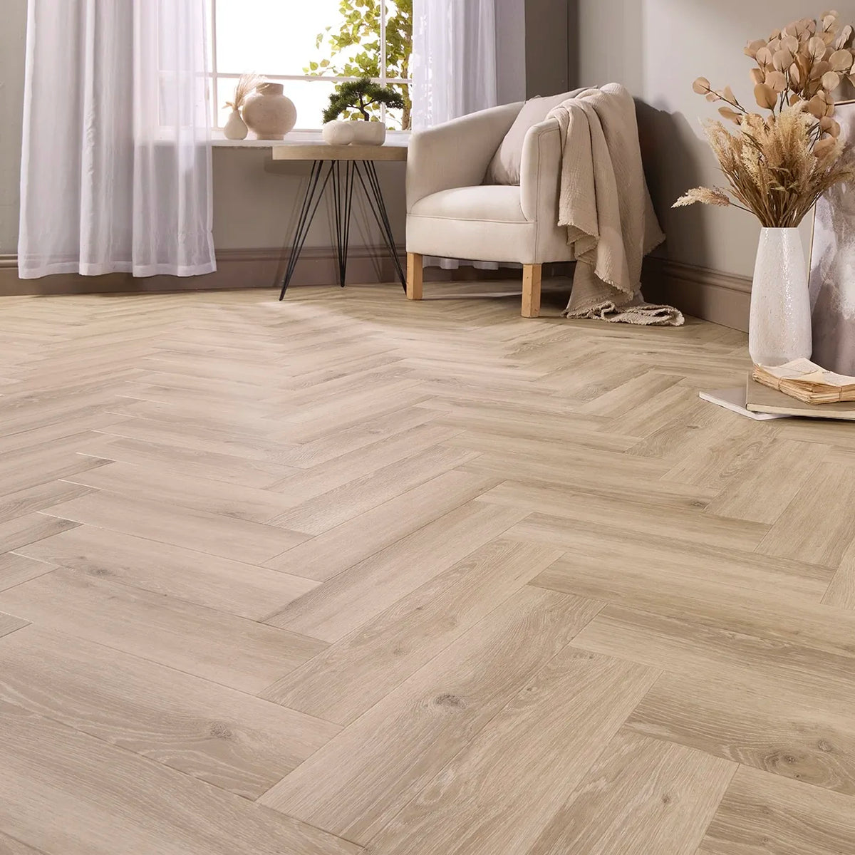 Toledo Oak Herringbone Glue Down LVT – laid in a living room