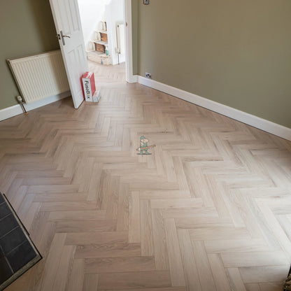 Glacier Oak Herringbone 12mm Laminate – fitted on a staircase