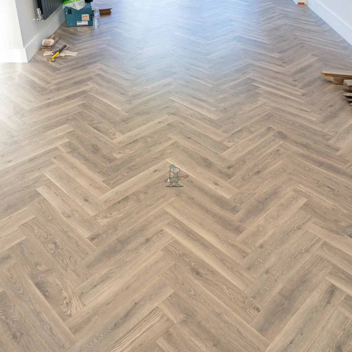 Providence Oak Herringbone 12mm Laminate – laid in a living room