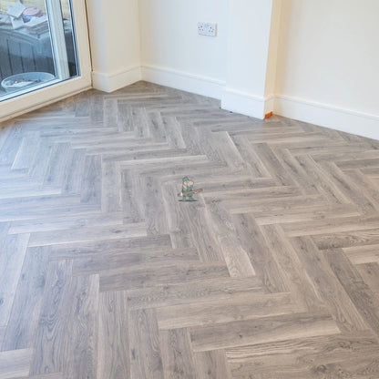 Providence Oak Herringbone 12mm Laminate – laid in a living room (2)