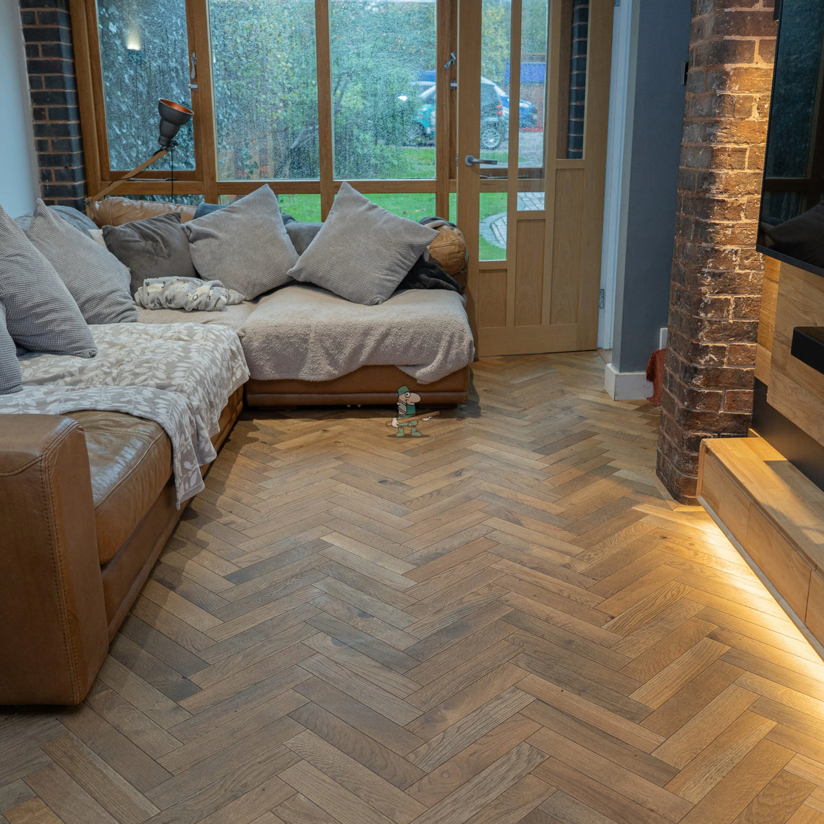 Worn Antique Oak 70mm Engineered Herringbone – laid in a living room