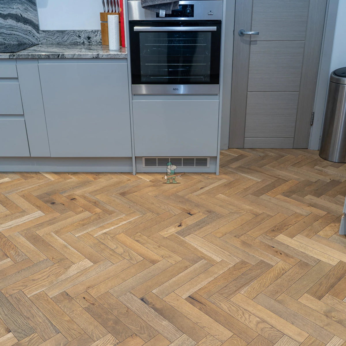 Worn Antique Oak 70mm Engineered Herringbone – laid in a kitchen