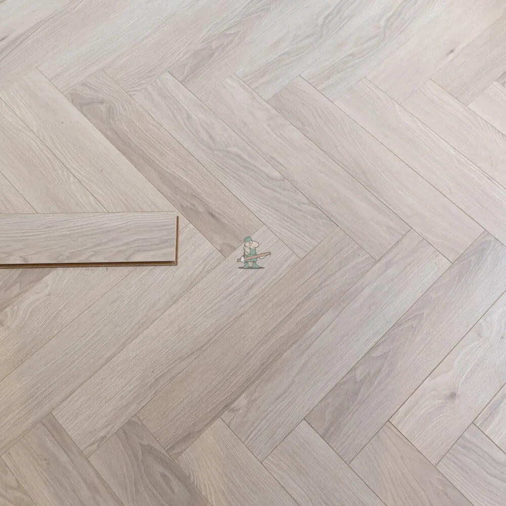 Glacier Oak Herringbone 12mm Laminate – close-up of the surface