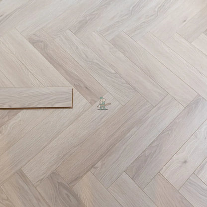 Glacier Oak Herringbone 12mm Laminate – close-up of the surface