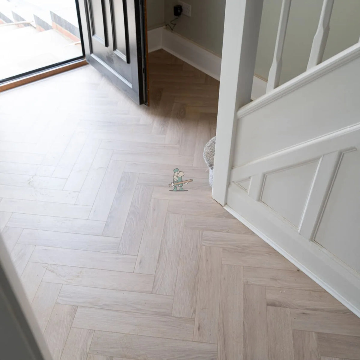 Glacier Oak Herringbone 12mm Laminate – laid in an entrance hall