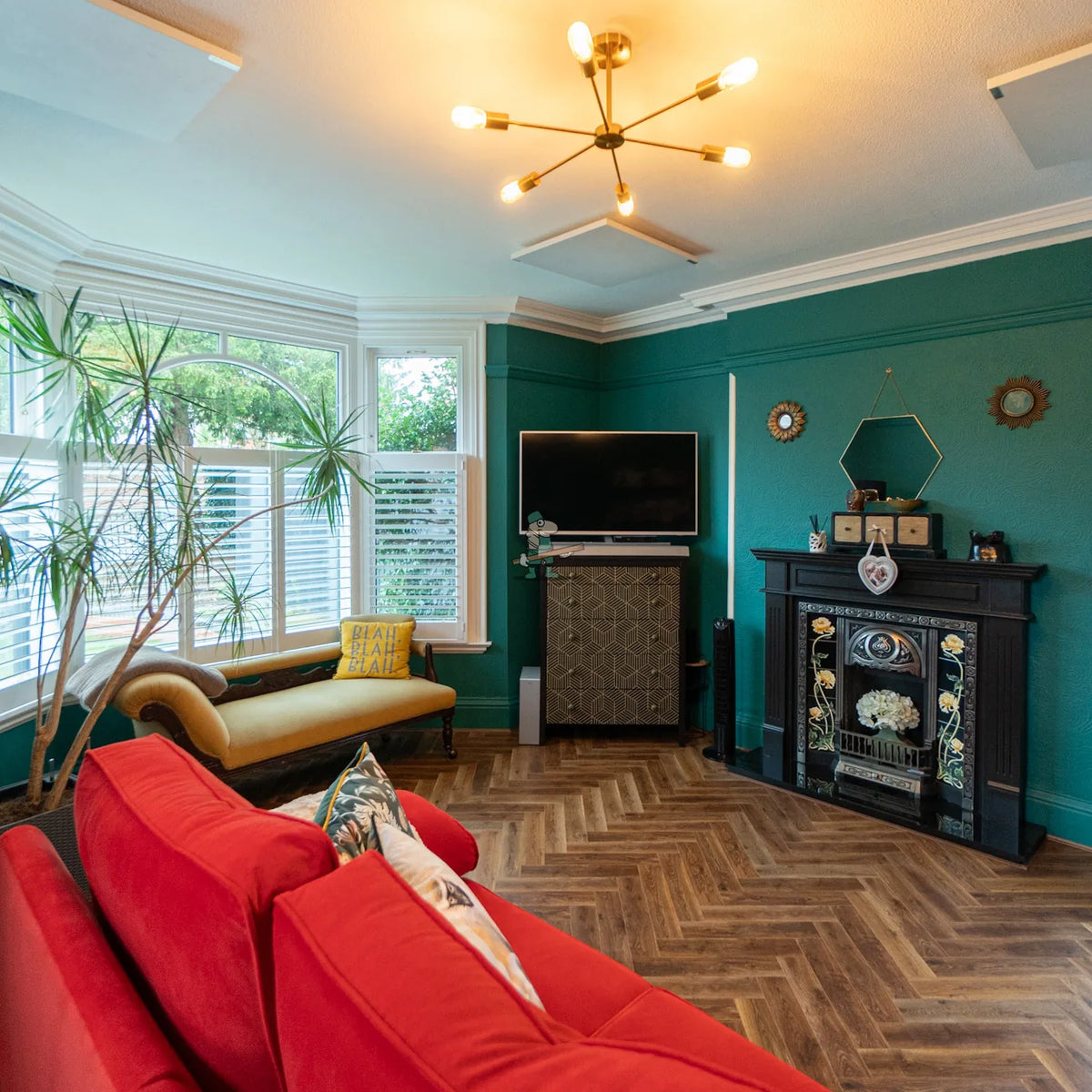 Terrain Oak Herringbone 12mm Laminate – laid in a living room