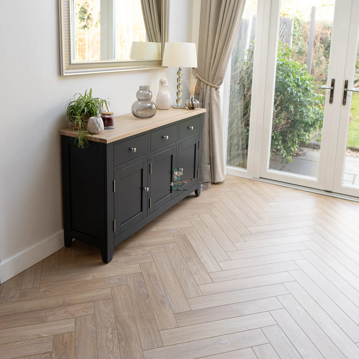 Desert Oak Herringbone 12mm Laminate – laid in a living room (2)