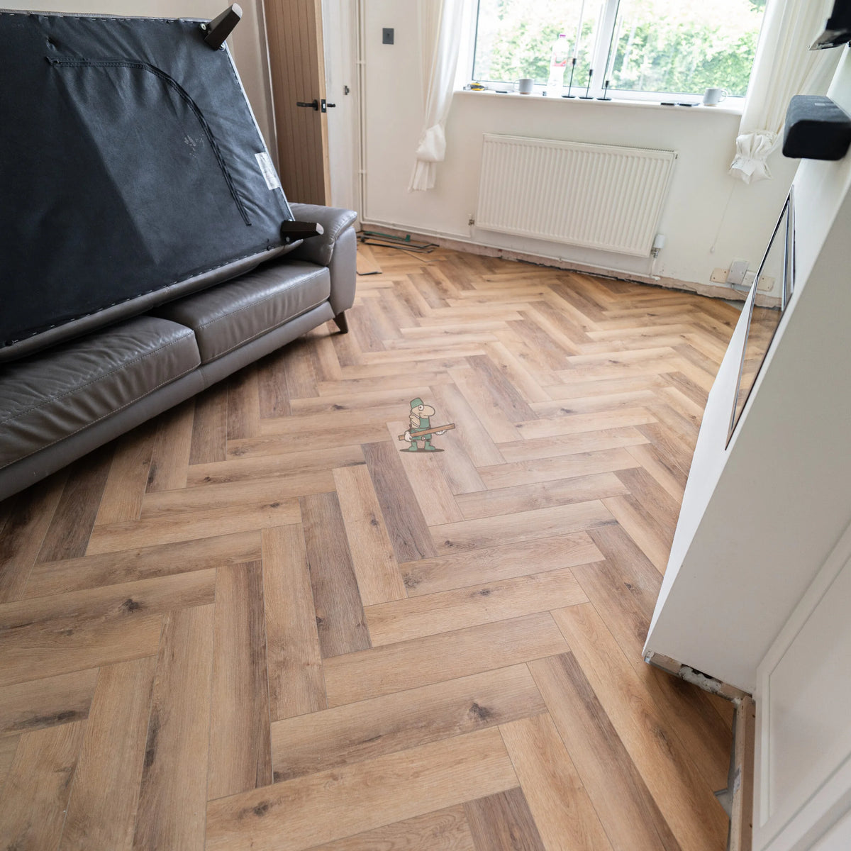 Warm Oak Herringbone Click LVT – laid in a living room (2)