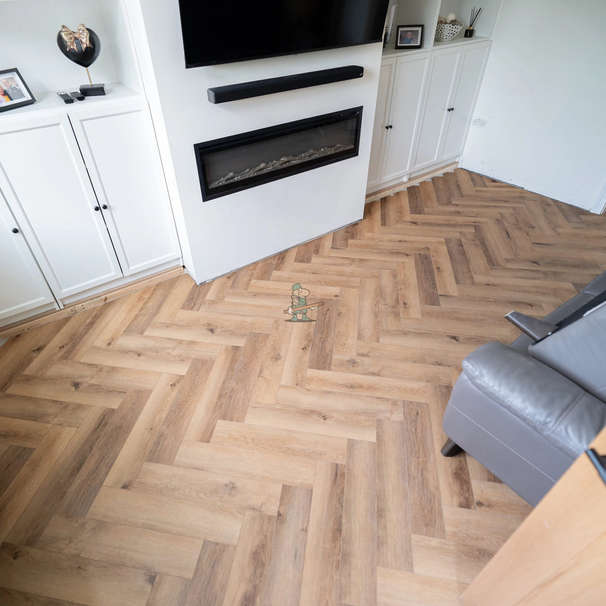 Warm Oak Herringbone Click LVT – laid in a lounge