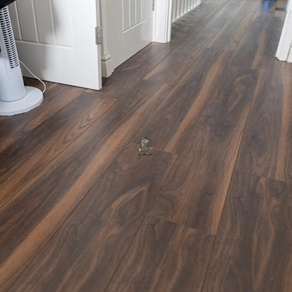 Dark American Walnut 12mm Laminate – laid in a hallway