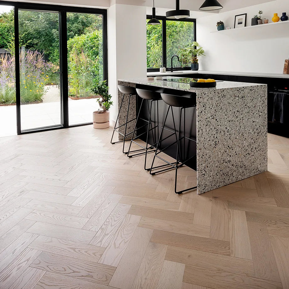 Pale Invisible Oak 150mm Engineered Herringbone, Prime Grade – laid in a kitchen