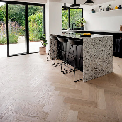 Pale Invisible Oak 150mm Engineered Herringbone, Prime Grade – laid in a kitchen
