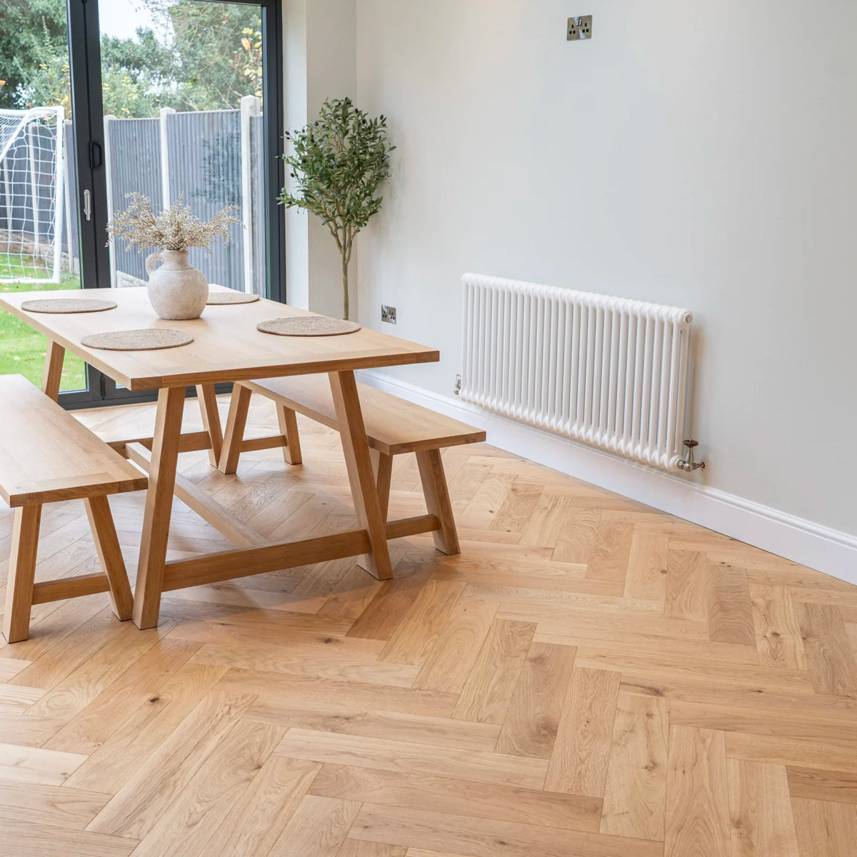 Natural Oak 125mm Engineered Herringbone – laid in a dining room