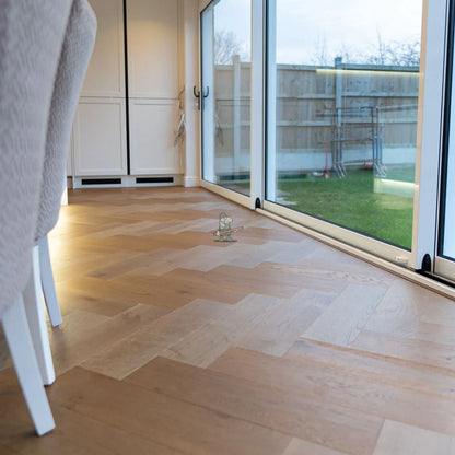 Caramel Oak 150mm Engineered Herringbone – laid in a dining room (2)