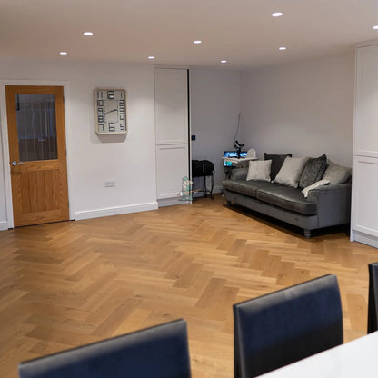 Caramel Oak 150mm Engineered Herringbone – laid in a dining room