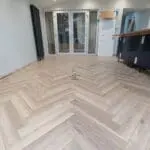 Greige Oak Herringbone Laminate Floor