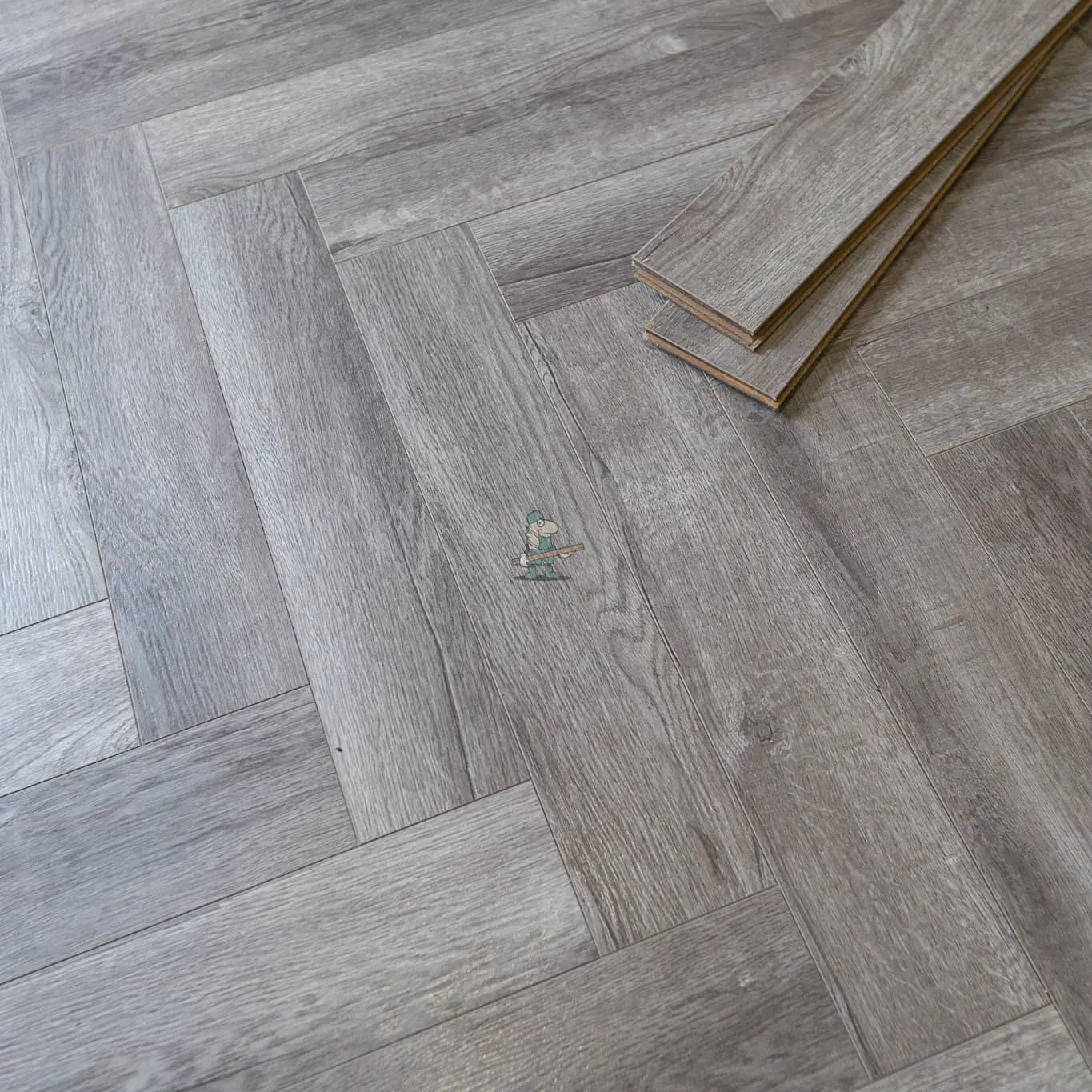 Craft 12mm Cosmic Grey Oak Herringbone AC5 Laminate Flooring