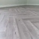 Craft 12mm Cosmic Grey Oak Herringbone AC5 Laminate Flooring