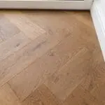 Riviera Click 14/3 x 150mm Caramel Oak Herringbone Engineered Wood Flooring in Dining Room (YHB1402C)
