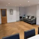 Riviera Click 14/3 x 150mm Caramel Oak Herringbone Engineered Wood Flooring in Dining Room (YHB1402C)