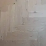 Riviera Prime Click 14/3 x 150mm Pale Invisible Oak Herringbone Engineered Wood Flooring