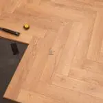 Flair 12mm Biscoff Oak Herringbone Laminate Flooring