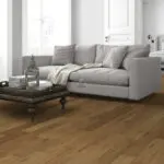 Light Smoked Oak Engineered Wood Flooring with a lacquered finish, showcasing warm golden tones and a textured surface.