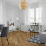 Light Smoked Oak Engineered Wood Flooring with lacquered finish, showcasing warm golden tones and a textured surface.