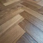 Grizzly Montreux Oak Herringbone Flooring with a brushed and lacquered double smoked finish