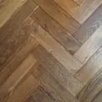 Grizzly Montreux Oak Herringbone Flooring with a brushed and lacquered double smoked finish
