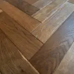 Grizzly Montreux Oak Herringbone Flooring with a brushed and lacquered double smoked finish