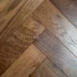 Grizzly Montreux Oak Herringbone Flooring with a brushed and lacquered double smoked finish