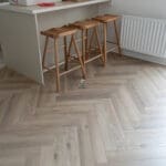 Fusion Greige Oak Herringbone Laminate Flooring