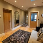 Elegant natural oak herringbone engineered wood flooring, featuring precise V-shaped patterns, rich wood textures, and a durable multi-layered construction