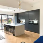 Natural Lacquered Oak Chevron Engineered Wood Flooring in a Modern Kitchen