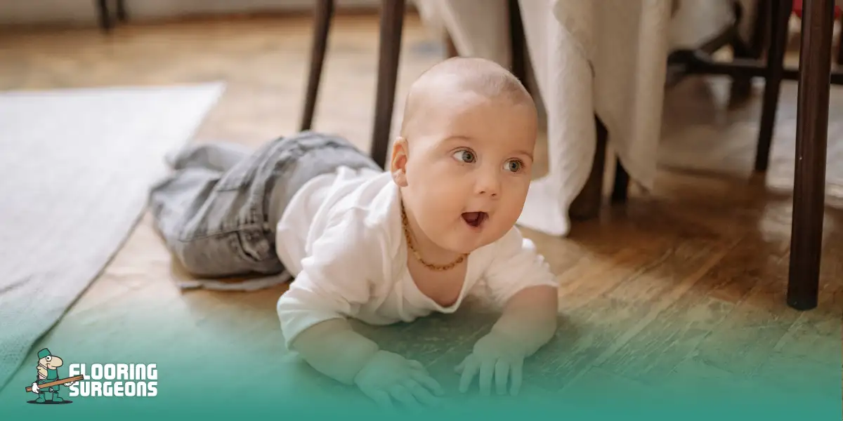 Baby crawling on a wooden floor, highlighting comfort and safety of home flooring.