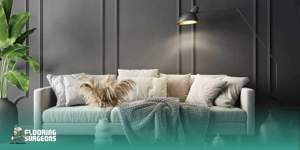 Living room colour scheme with dark wall panelling, light sofa, and neutral textured accessories