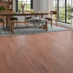 Close-up of chestnut brown oak laminate flooring with natural wood grain texture