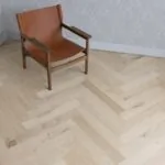 Unfinished Oak Herringbone Engineered Wood Flooring in modren living room.