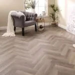 Aragon Oak Herringbone Glue Down LVT Flooring in modern living room