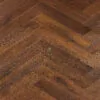 Espresso Oak Herringbone AC5 Laminate Flooring with rich dark brown wood grain.
