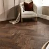 Espresso Oak Herringbone AC5 Laminate Flooring with rich dark brown wood grain.
